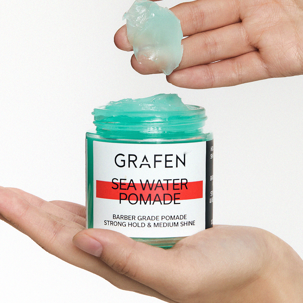 GRAFEN Sea Water Pomade 100g open jar held in hands showing aqua gel texture for men by Gentleman Korea