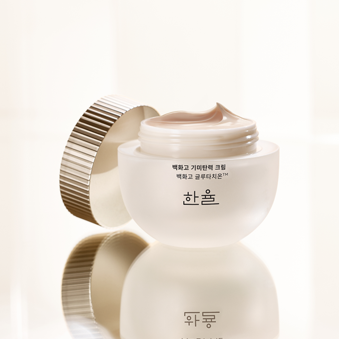 HANYUL Baekhwago Gimitanryuk Cream 60ml in elegant jar with open lid, showcasing luxurious texture, perfect for skincare