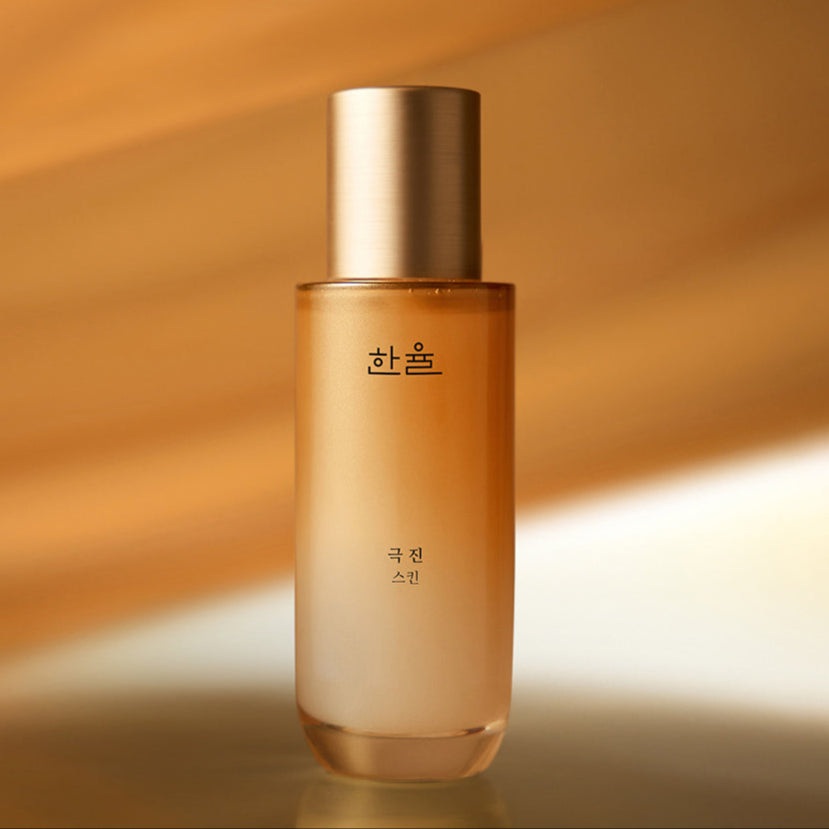 HANYUL Extreme Skin 125ml in a sleek bottle with a golden cap against a warm background.