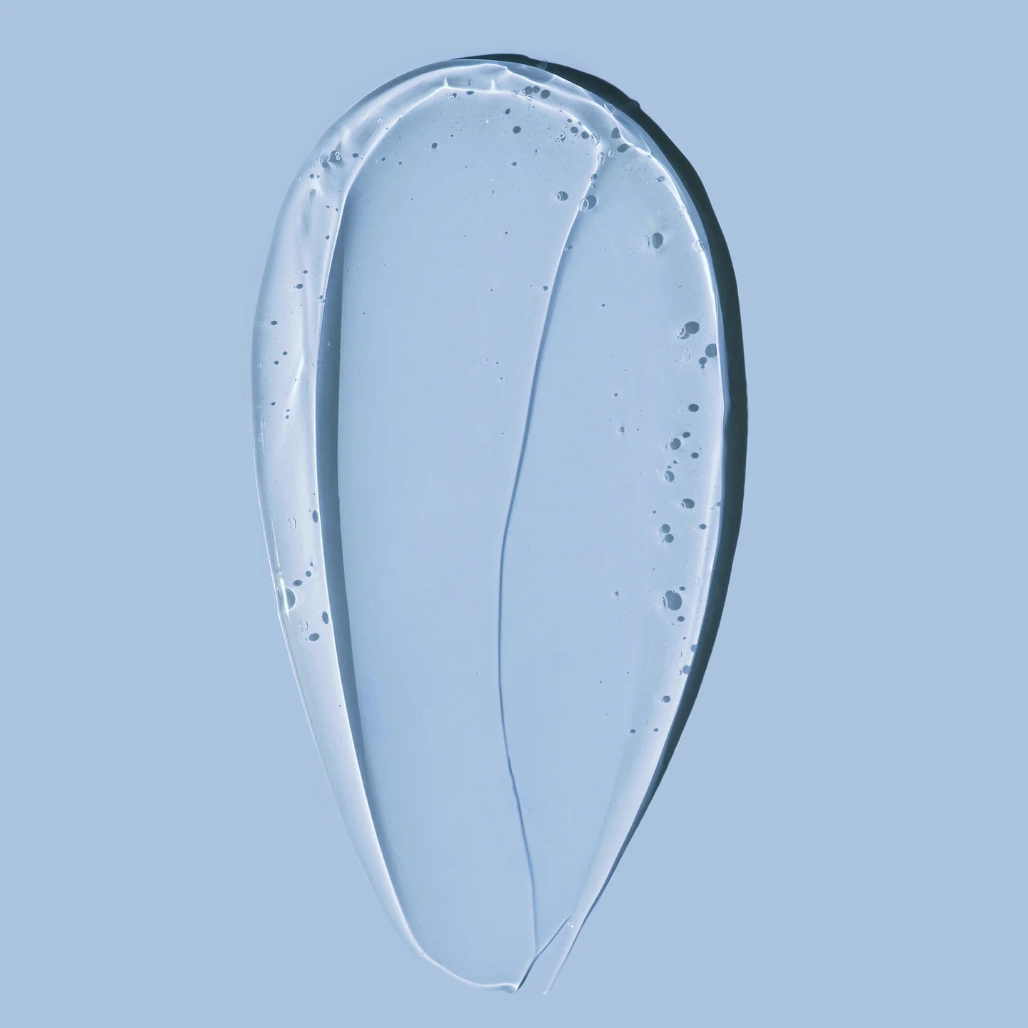 Texture of HARU HARU Black Rice Hyaluronic Essence 50ml on a blue background