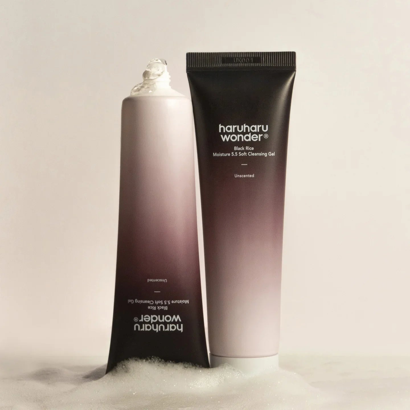 HARU HARU Black Rice Moisture Mildly Acidic Soft Cleansing Gel 100ml in purple and white packaging on a cream background.