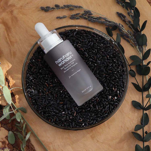 HARUHARU Black Rice Hyaluronic Botanical 2GF Wonderful Ampoule 30ml bottle on black rice bed