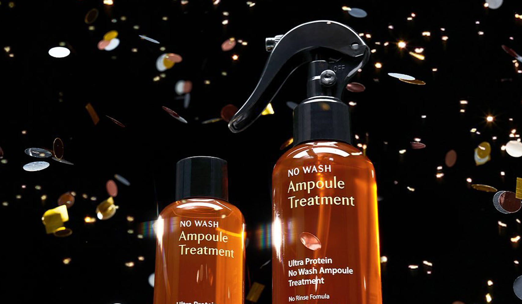 No Wash Ampoule Treatment bottles with nozzle against dark background, surrounded by glitter, highlighting hair care product.