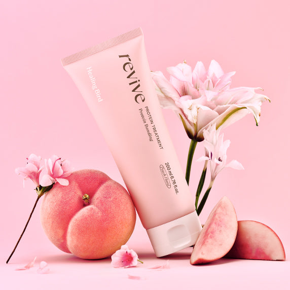 HEALING BIRD Revive Protein Treatment Plan 200ml with pink flowers and peach on pink background