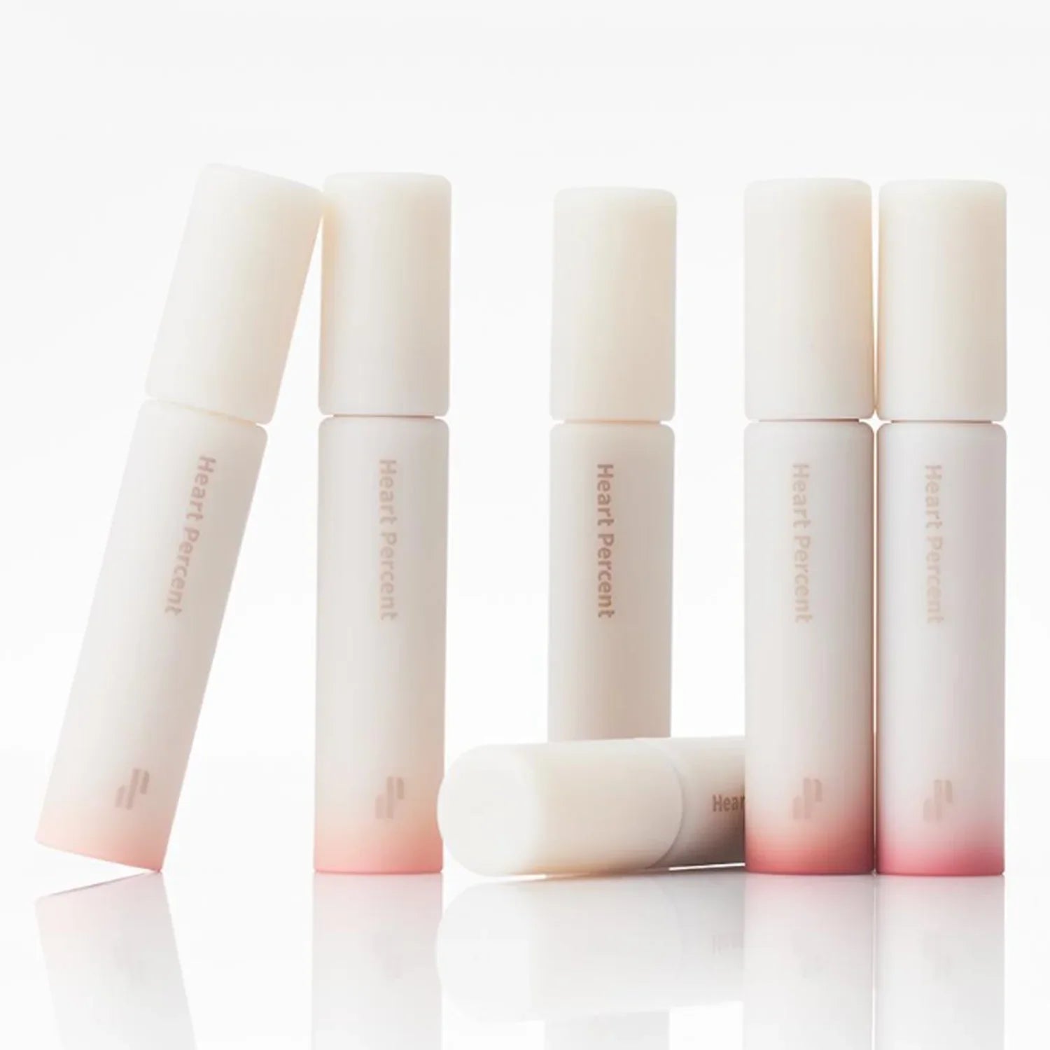HEART PERCENT Dot On Mood All Cover Lip Base in elegant packaging with gradient design, perfect for a flawless lip finish.
