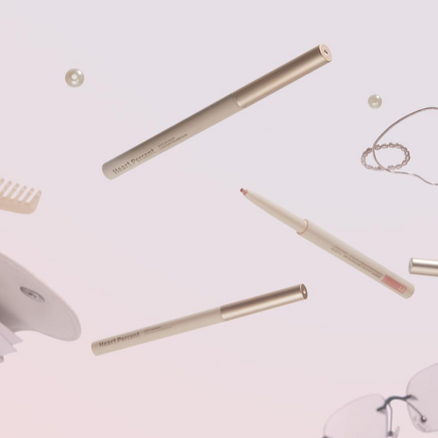 HEART PERCENT Dot On Mood Contour Eyeliner Slim floating amid accessories.