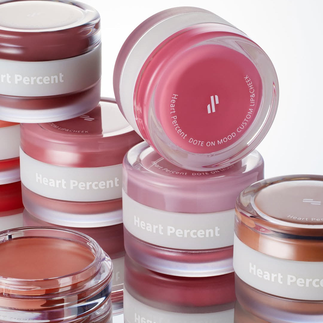 Various shades of HEART PERCENT Dot On Mood Custom Lip & Cheek products in jars
