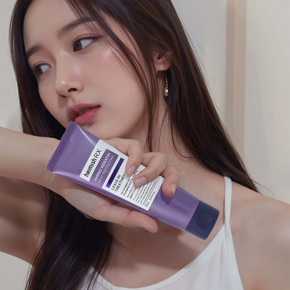 Woman holding HEIMISH RX Amino Keratin Heat Protecting Leave-in Treatment 150ml