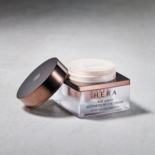 HERA Age Away Aesthetic BX Eye Cream 25ml in a luxurious jar with open lid on a sleek background.