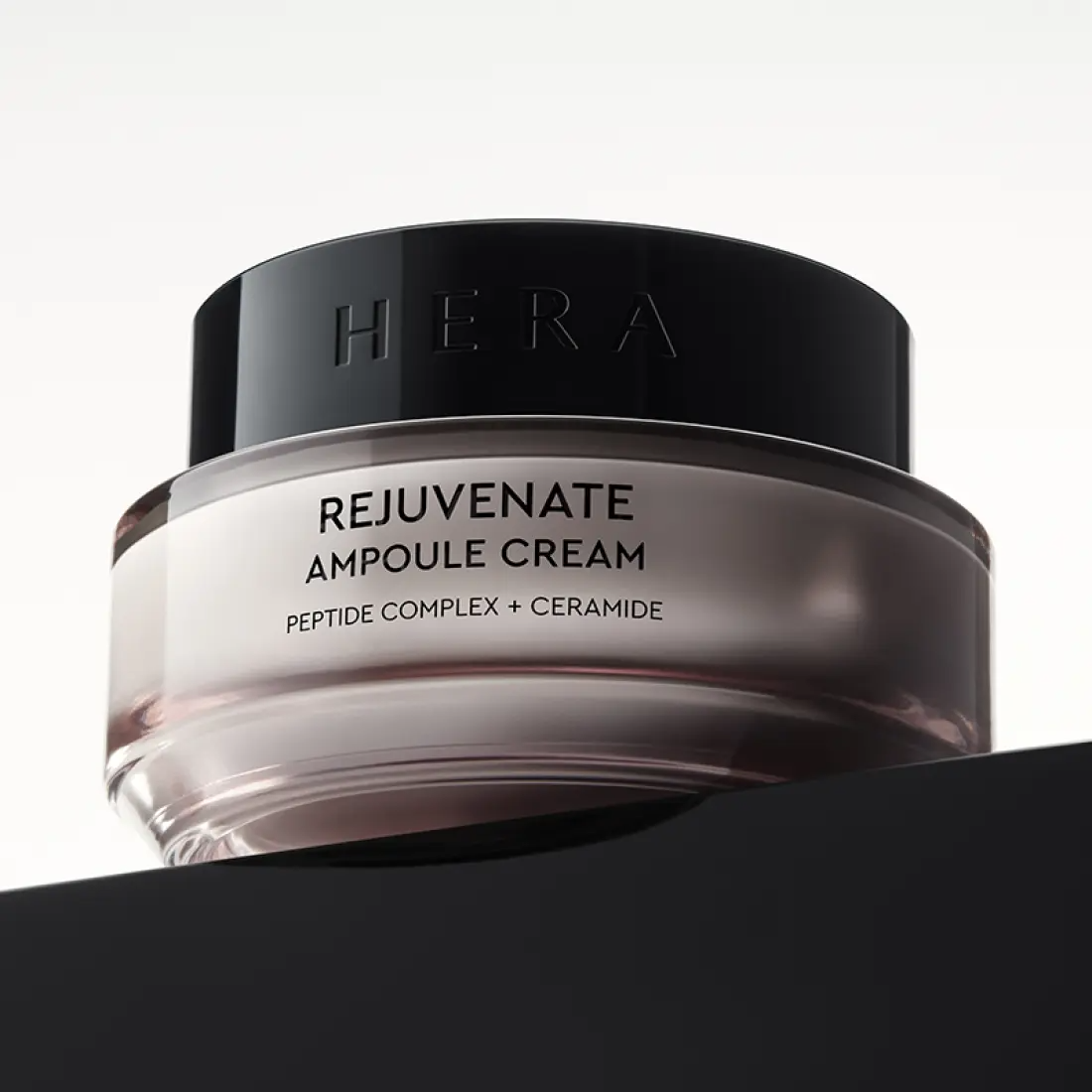 HERA Rejuvanate Ampoule Cream 50ml jar with peptide complex and ceramide, view from front on a stark background.