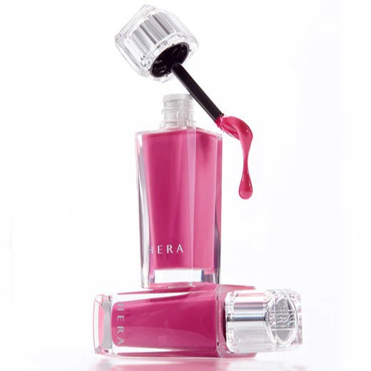 HERA Sensual Fiting Glow Tint 5g, vibrant pink gloss, open bottle with dripping brush, lip tint beauty and style, 5g luxurious gloss