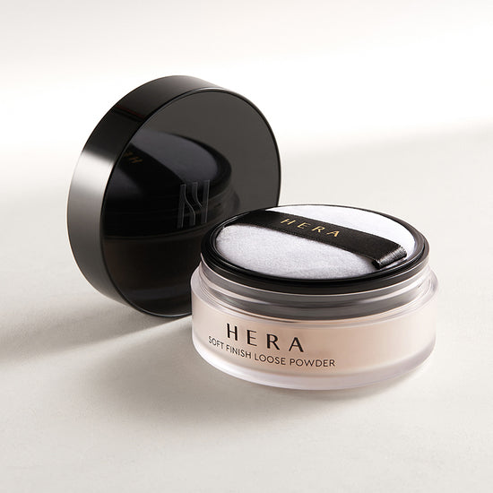 HERA Soft Finish Loose Powder 15g with applicator and open lid on neutral background.