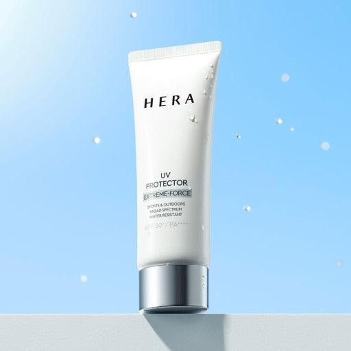 HERA UV Protector Extreme-Force Leports SPF50+PA++++ displayed against a blue sky background, showcasing its waterproof formula.