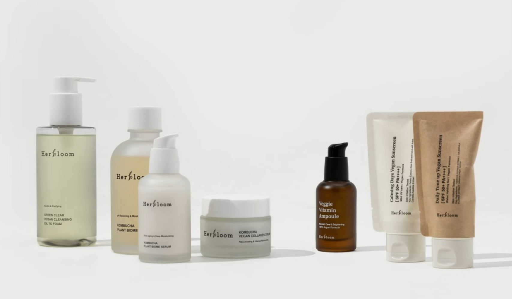 Collection of Herbloom skincare products including creams and lotions on a white background.