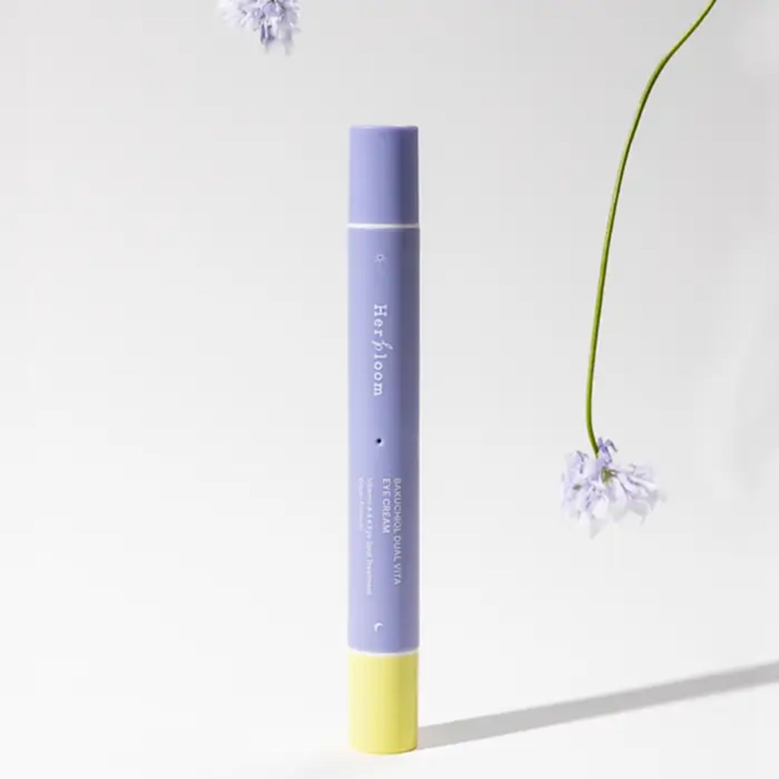 HERBLOOM Bakuchiol Dual Vita Eye Cream tube with flowers on a white background