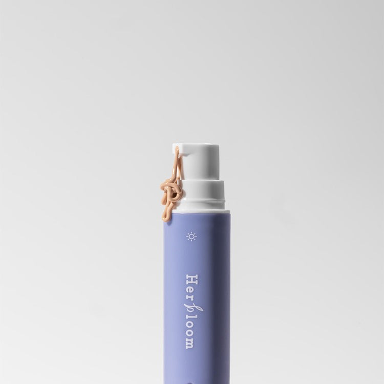 HERBLOOM Bakuchiol Dual Vita Eye Cream in sleek purple packaging with a pump dispenser for targeted skincare solutions.