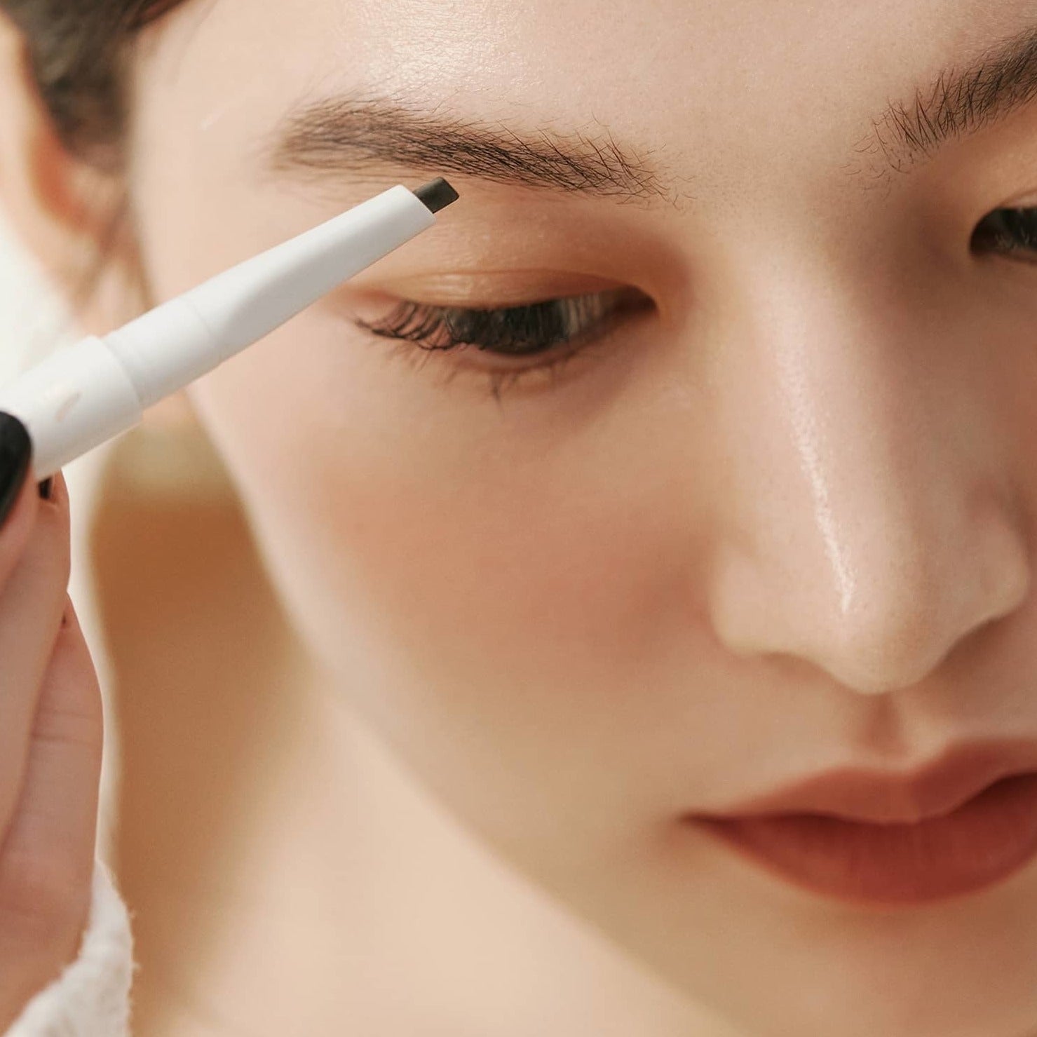 HINCE Signature Brow Pencil applied to eyebrow for precise shaping