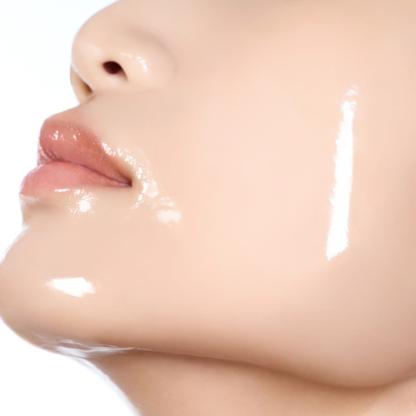 Close-up of face using HUXLEY BioSIS 360 Wrapping Gel Mask 35g, showcasing smooth, hydrated skin.