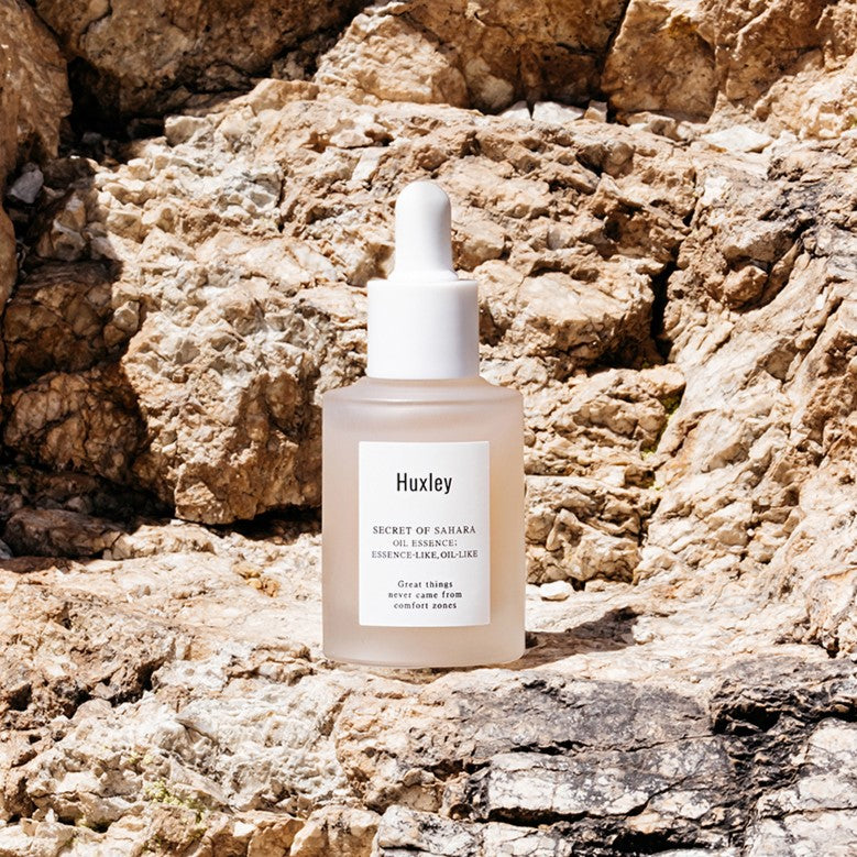 HUXLEY Oil Essence Like Oil Like 30ml bottle on rocky backdrop