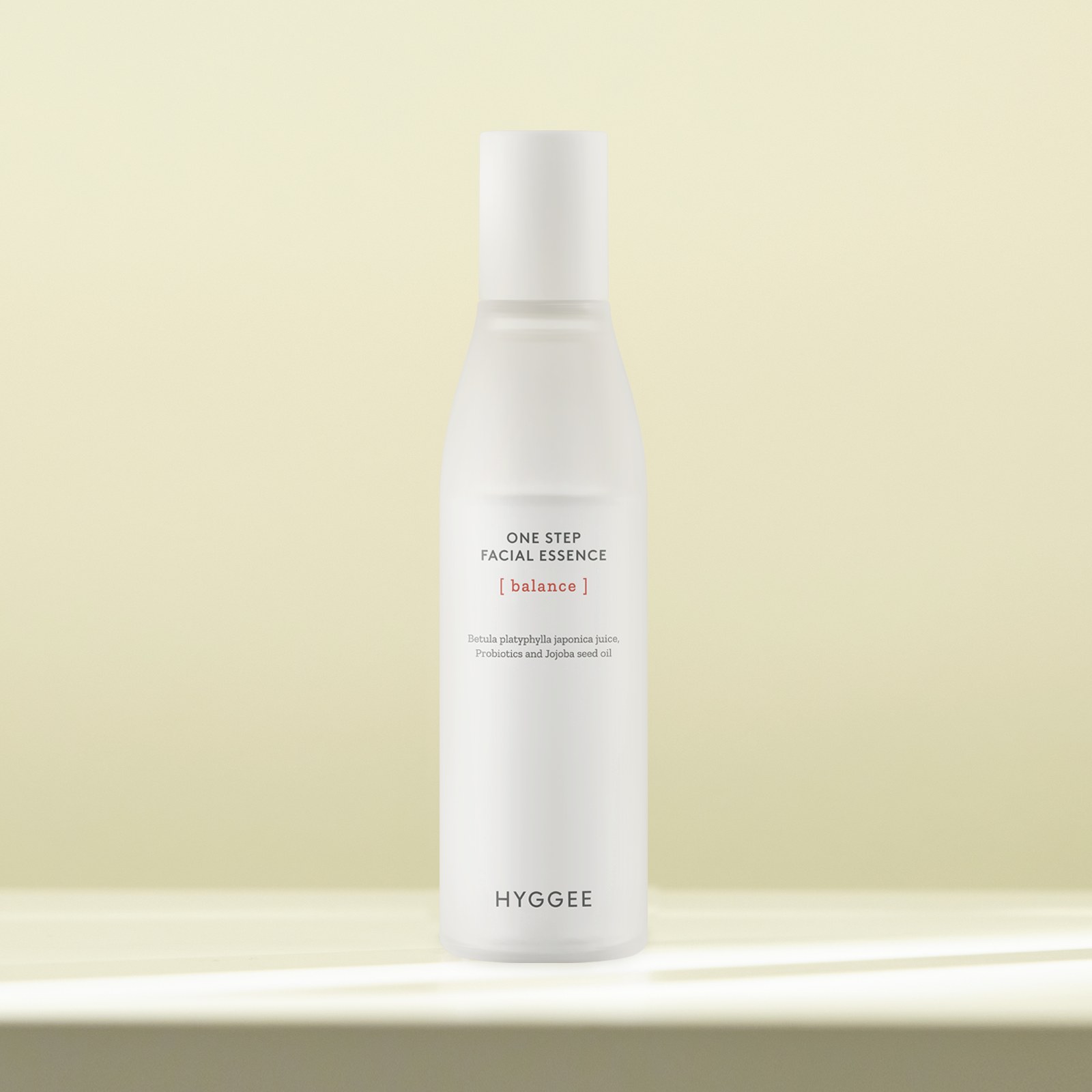 HYGGEE One Step Facial Essence 110ml bottle displayed on a smooth surface, highlighting its minimalistic and elegant design.