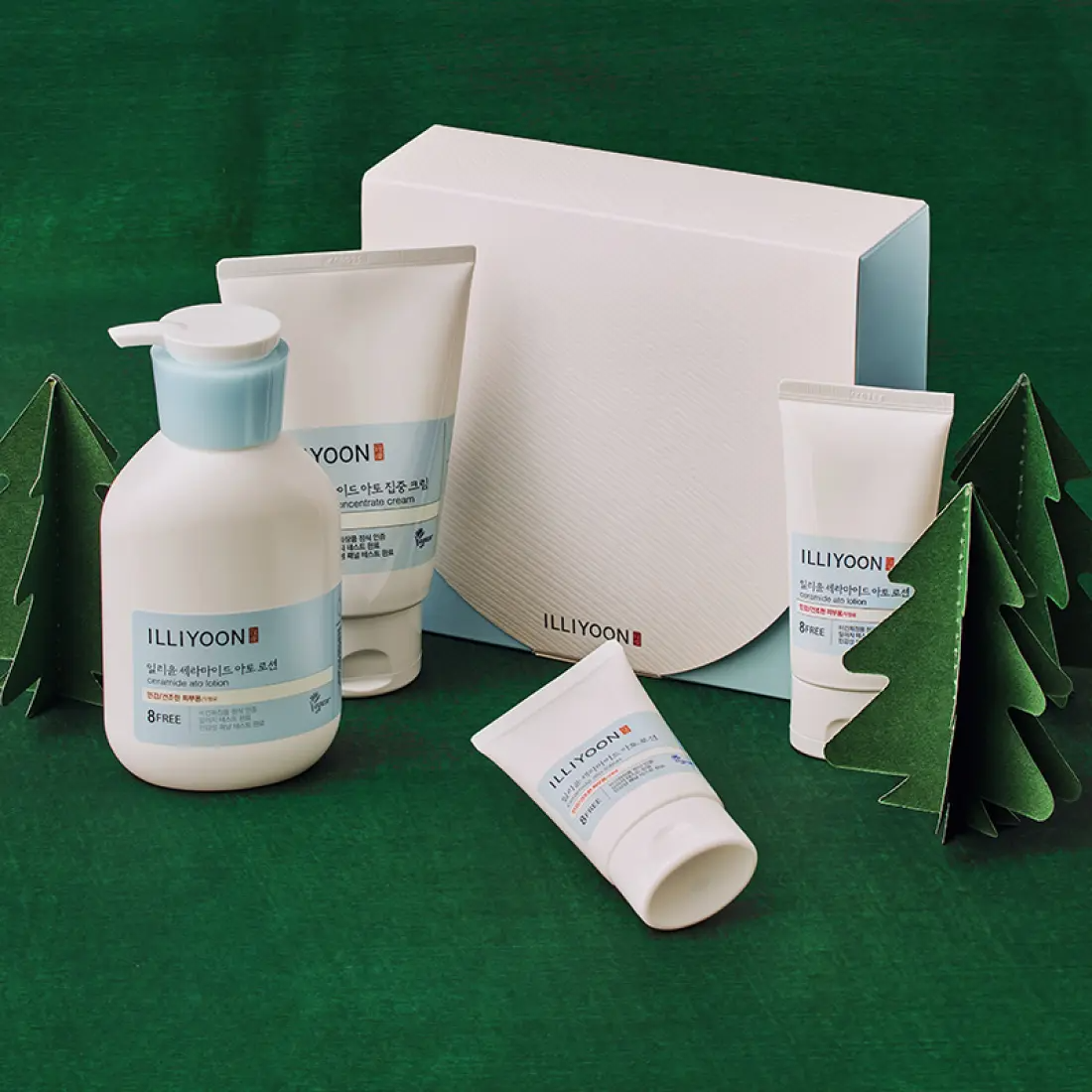 ILLIYOON Ceramide Ato Duo SET displayed with packaging and skincare bottles on a green background