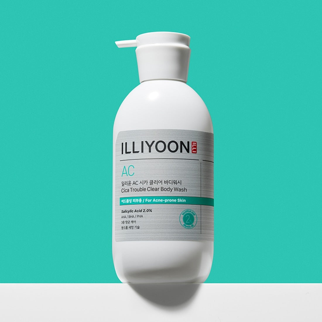 ILLIYOON Cica Acne Clear Body Wash 400ml bottle on a turquoise background for acne-prone skin