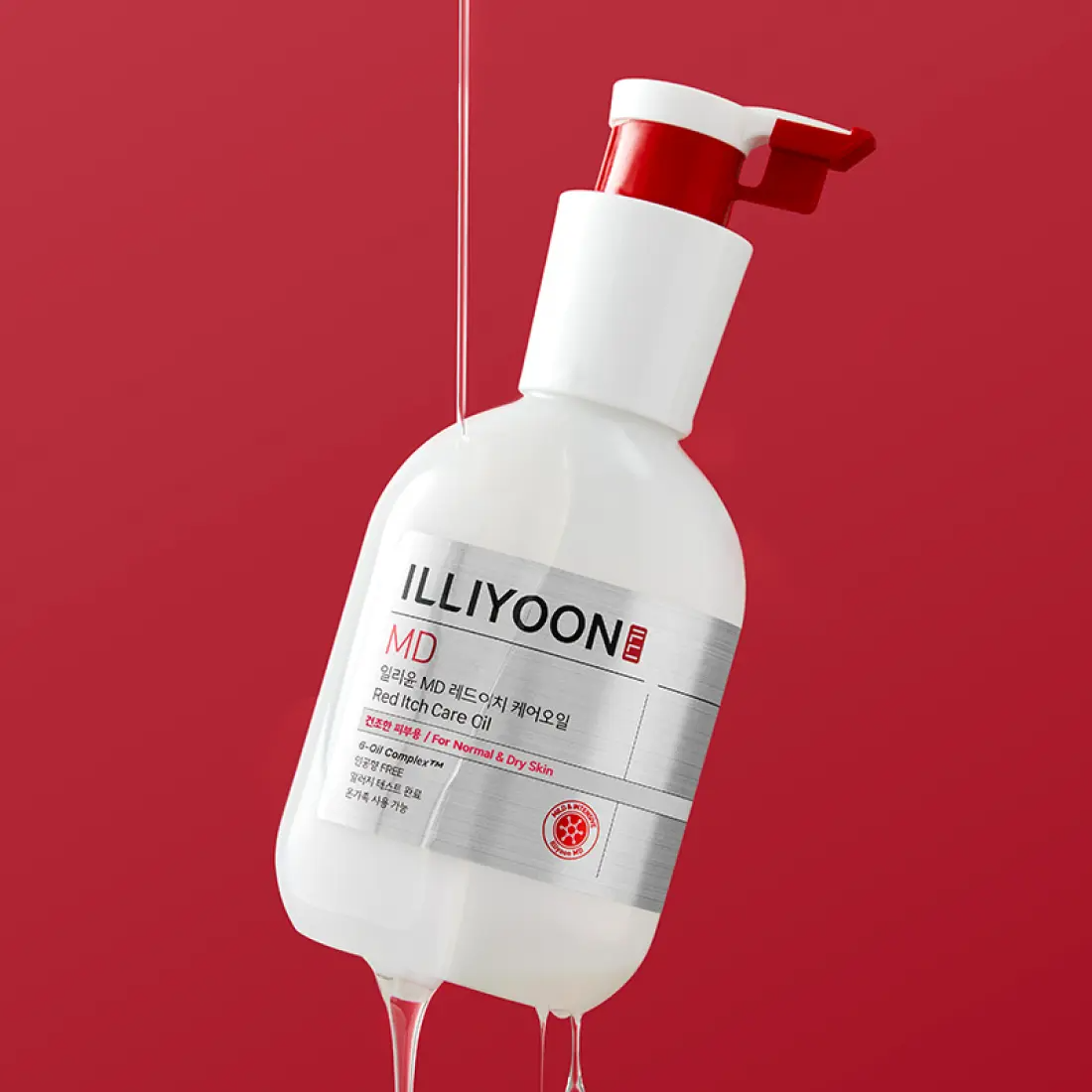 ILLIYOON Redich Care Oil 200ml bottle with dispenser against red background, skincare product