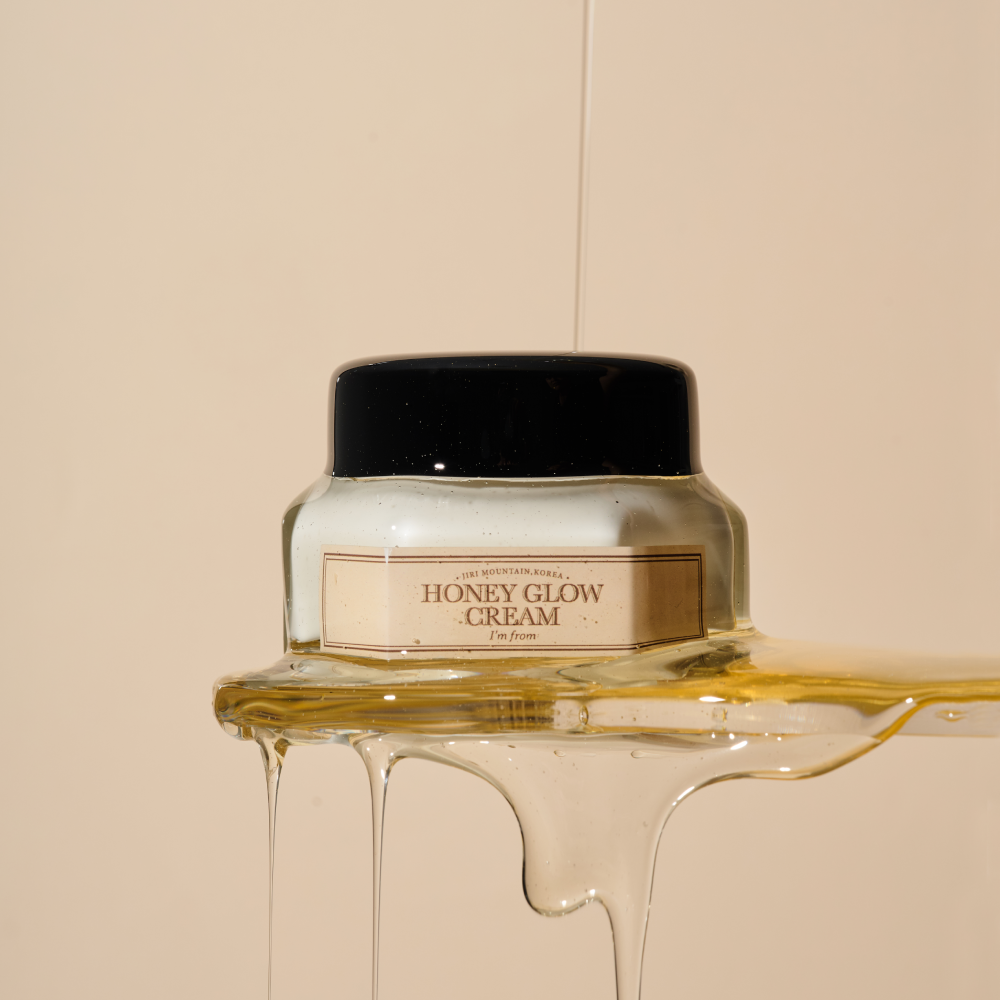 I'M FROM Honey Glow Cream 50g jar with honey drizzling over the product against a neutral background for skincare and hydration.
