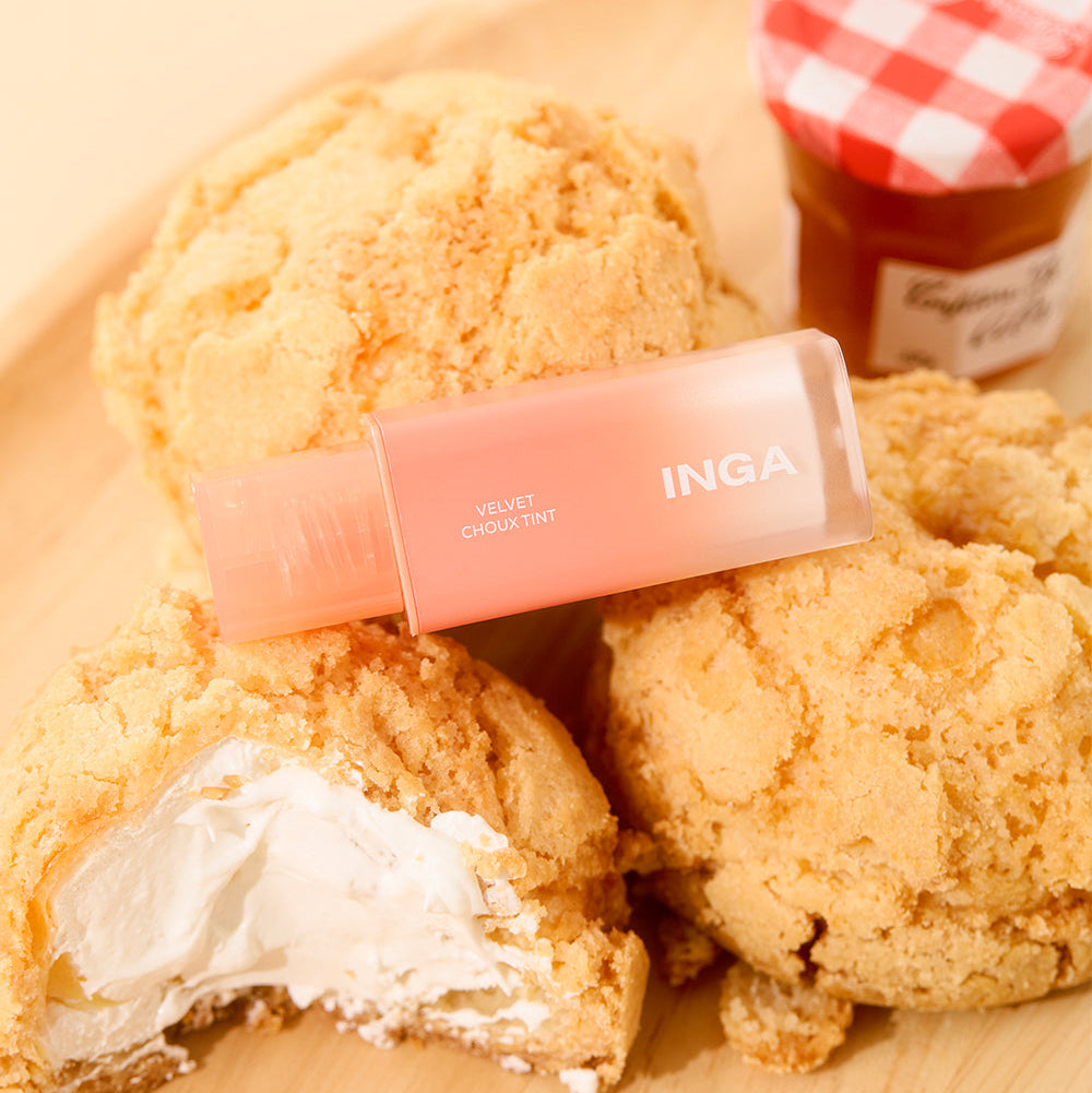 INGA Velvet Stain placed on cream puffs, with a jar of jam in the background for a vibrant presentation.