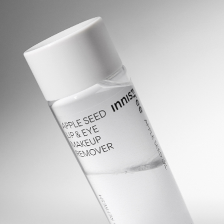 INNISFREE Apple Seed Lip & Eye MakeUp Remover 100ml bottle on a gray background