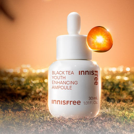 INNISFREE Black Tea Youth Enhancing Ampoule on a glowing background