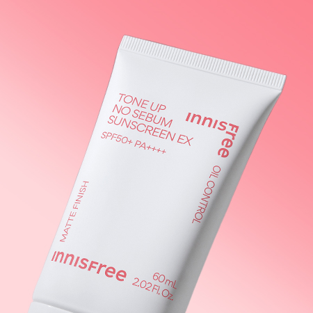 INNISFREE Tone Up No Sebum Sunscreen EX SPF 50+ PA++++ 60ml on a pink background