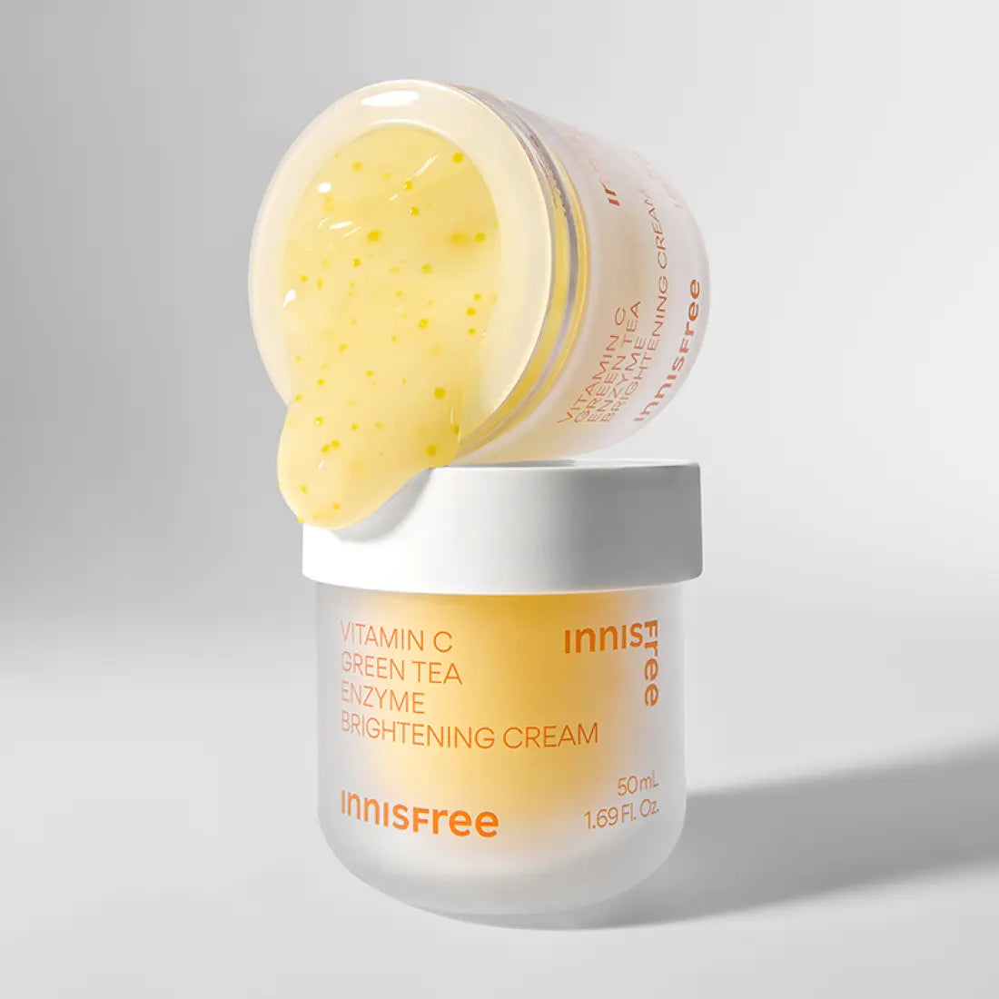 INNISFREE Vitamin C Enzyme Brightening Cream 50ml jar with cream spilling over the edge