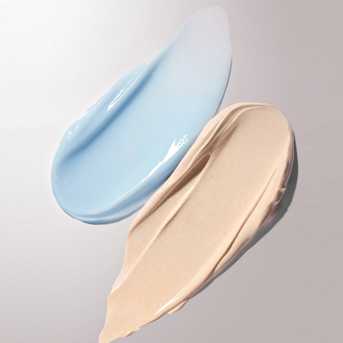 Texture of INNISFREE Volcanic Pore Dual Mask 110ml showing blue and beige clay swatches for skin care.