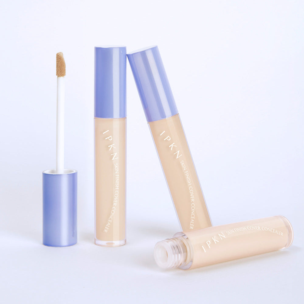 IPKN Skin Finish Cover Concealer SPF30 PA++ shown with open and closed tubes for skin coverage and sun protection.