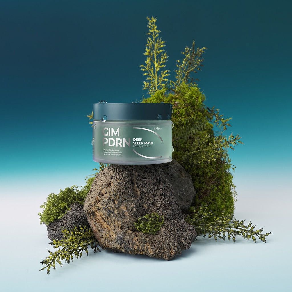 ISNTREE Gim PDRN Deep SLeep Mask 80ml on rocks with greenery background