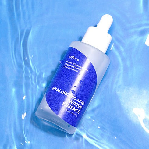 Bottle of ISNTREE Hyaluronic Acid Water Essence 50ml on blue water background