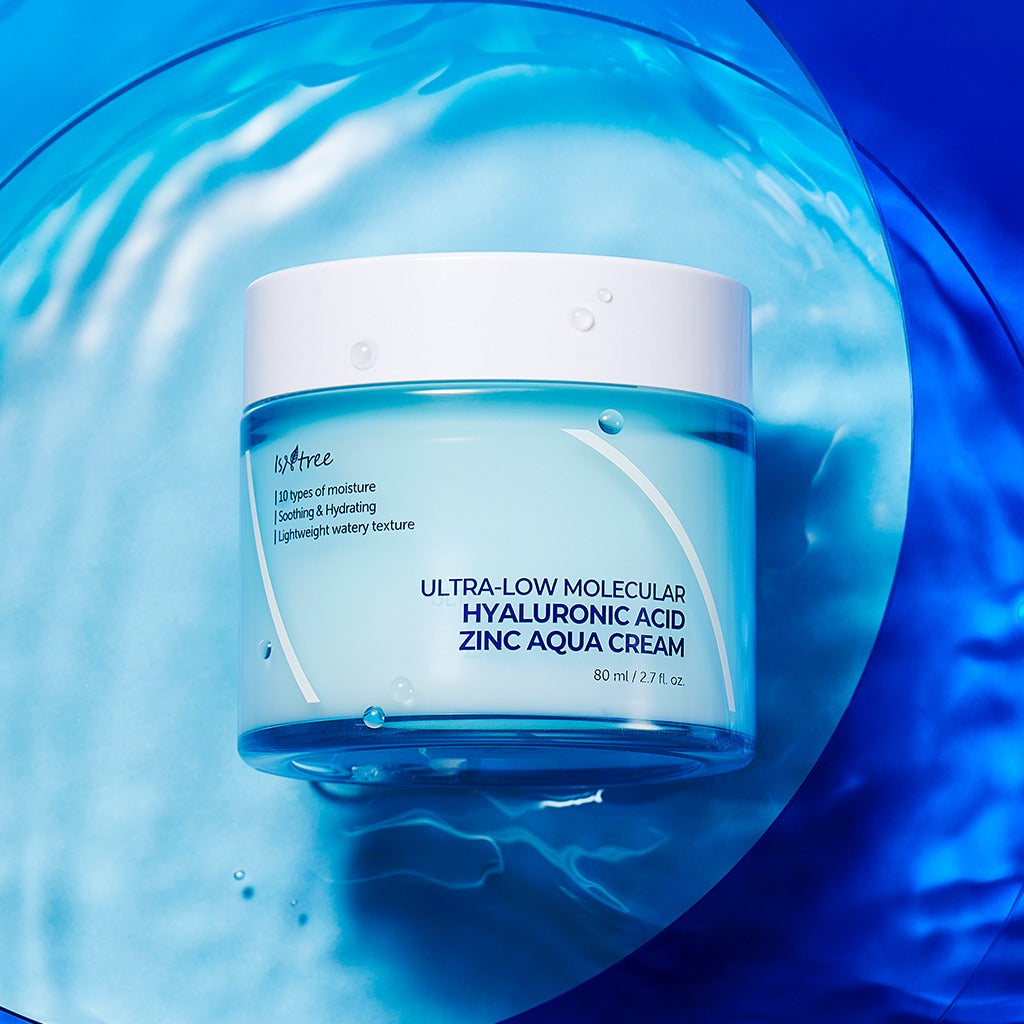 ISNTREE Hyaluronic Acid ZINC Moisture Cream 80ml jar on a blue water background