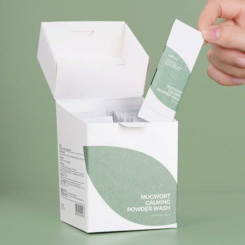 Box and sachet of ISNTREE Mugwort Calming Powder Wash x25 with green leaf design.