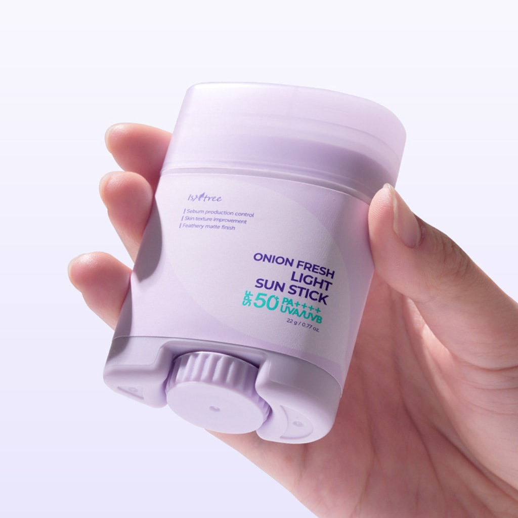 ISNTREE Onion Fresh Light Sun Stick 22g in hand, SPF 50 sun protection skincare.