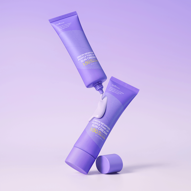 ISNTREE Onion Newpair Purple Tone-Up Sunscreen 50ml displayed on a purple background with two tubes and flowing cream.