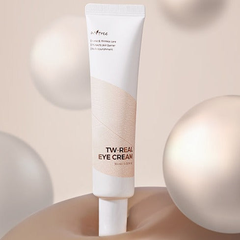 Tube of ISNTREE TW-Real Eye Cream 30ml surrounded by elegant spheres on a neutral background.