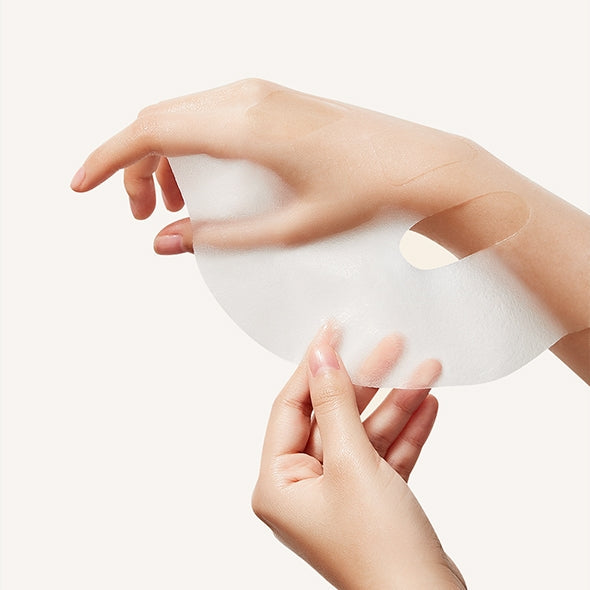Person applying IT'S SKIN Power 10 Licorice Julen Jelly Mask Pack to hand for skincare.