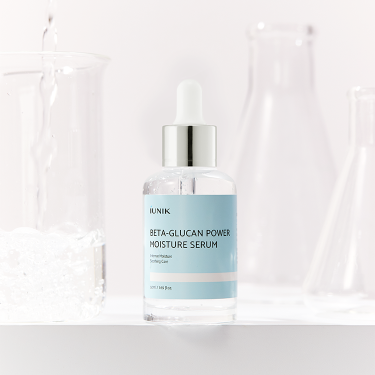 IUNIK Beta Glucan Power Moisture Serum 50ml bottle displayed with laboratory beakers in the background