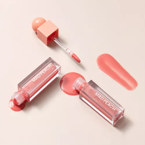 IVI MAD PEACH Glow Fit Mood Gloss with open applicator showcasing peach color and shine