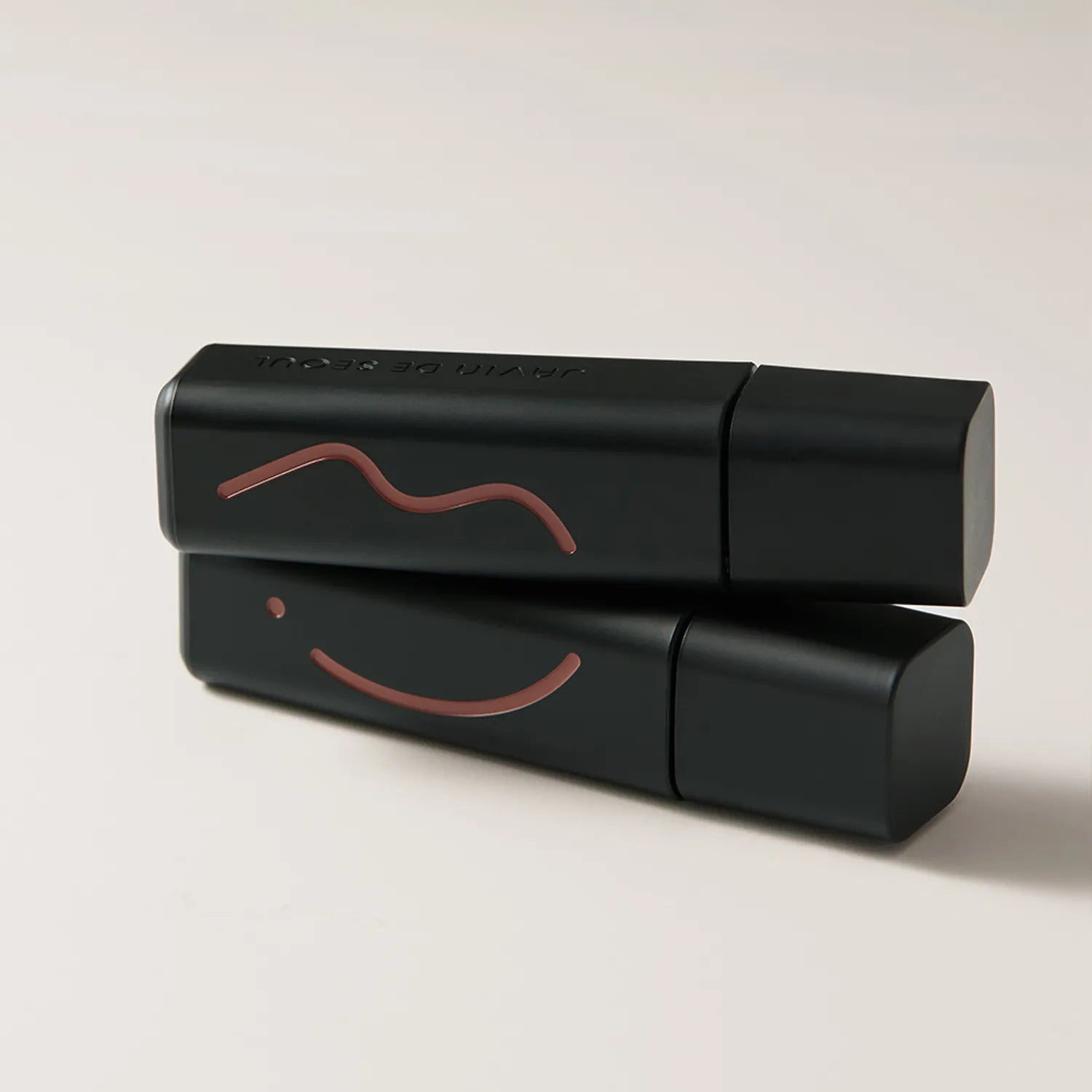 JAVIN DE SEOUL Wink Lip Shade Primer with elegant black packaging and artistic line design