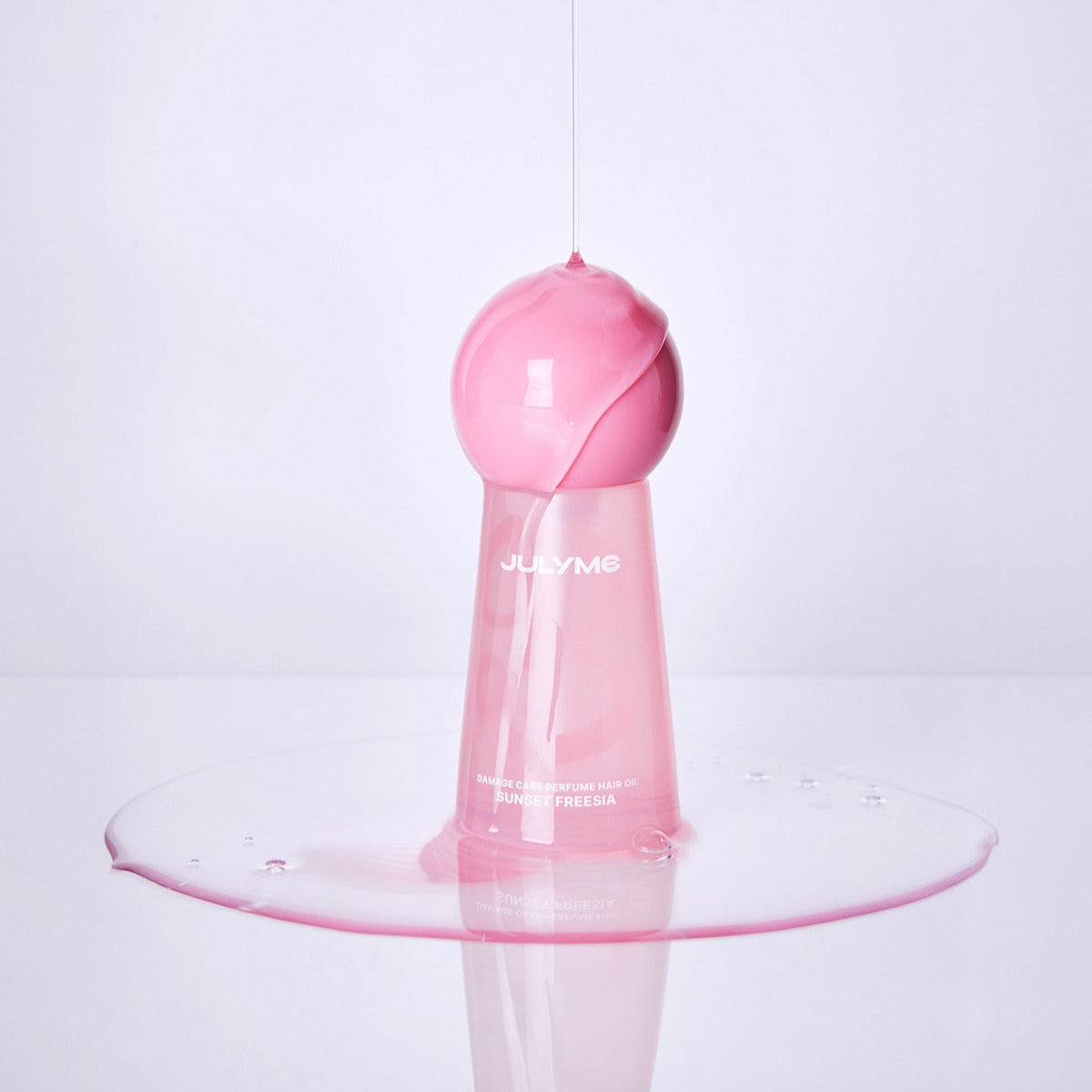 JULYME Damage Care Perfume Hair Oil 30ml bottle with pink liquid design on a white background