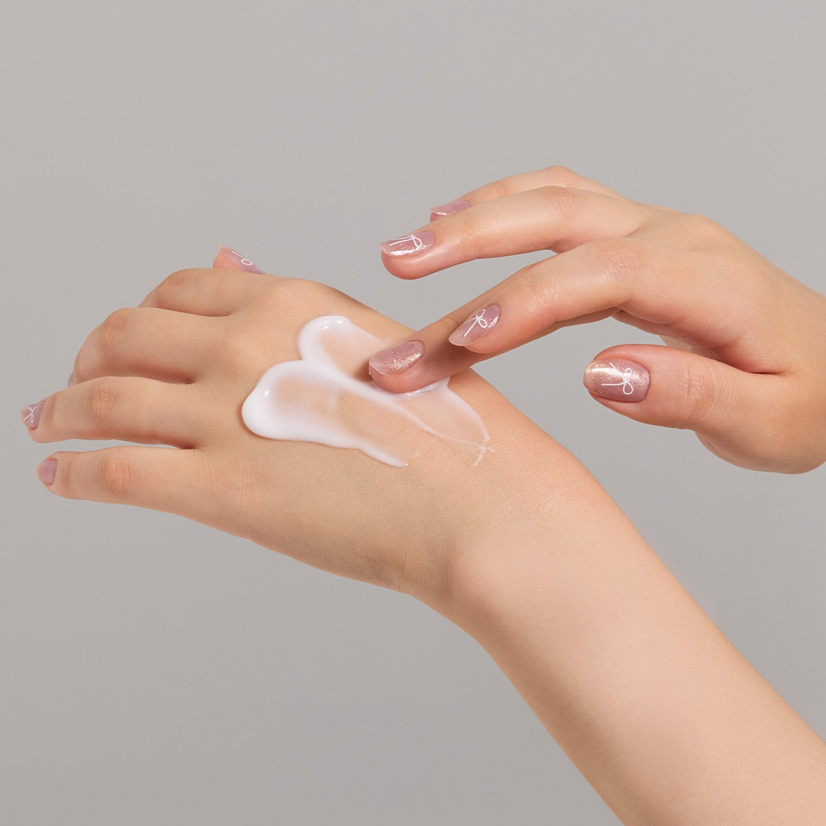 Applying JULYME Perfume Shea Butter Hand Cream 30ml on hands for moisturizing