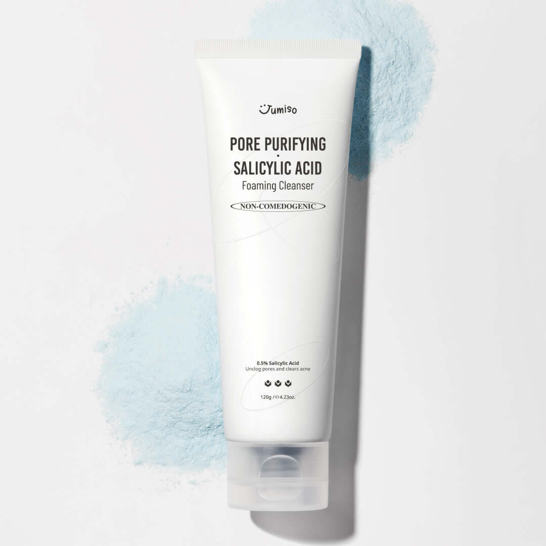 JUMISO Pore Purifiying Salicylic Acid Foaming Cleanser bottle against a blue background