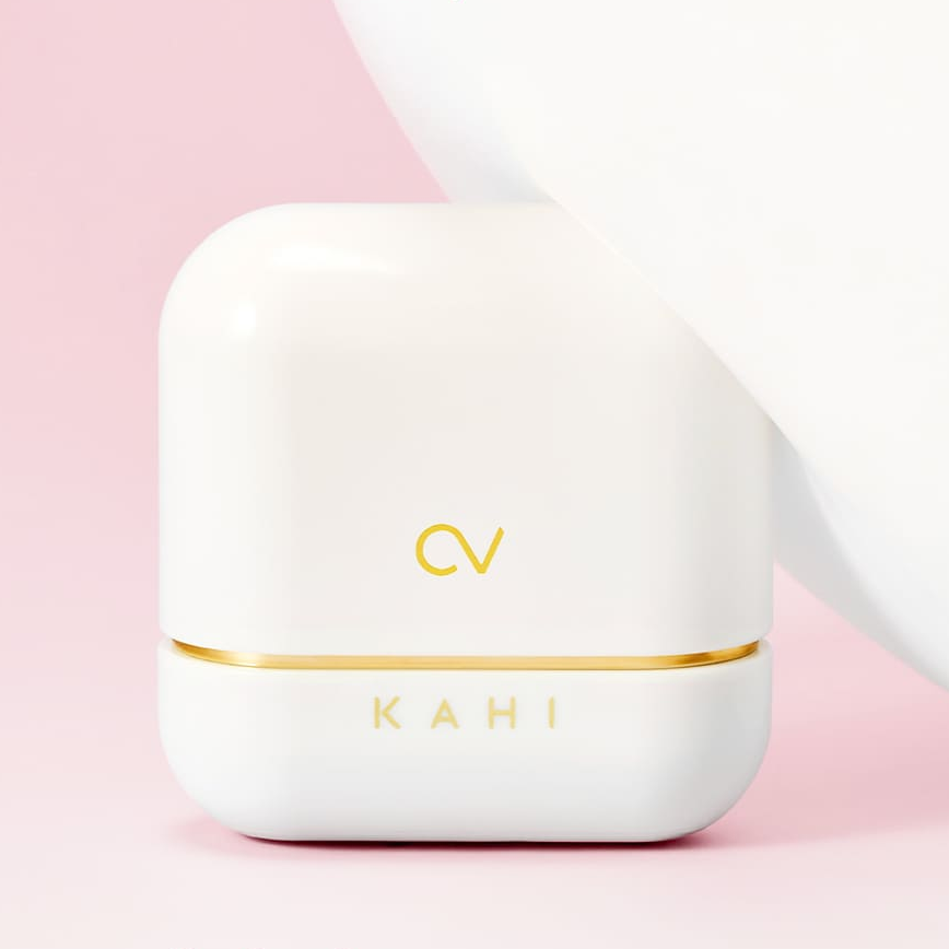 KAHI CV Shine Fit Sun Stick (13.5g) product packaging on a pink background